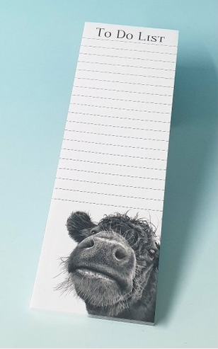 Magnetic shopping list with an image of a cow